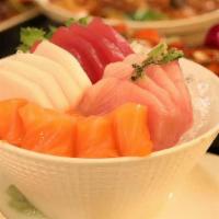 Trio Sashimi · 6 pieces of tuna, 6 pieces of salmon and 6 pieces of yellowtail sashimi.