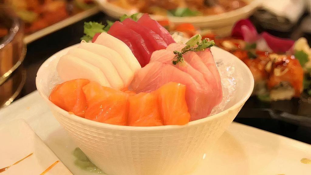 Trio Sashimi · 6 pieces of tuna, 6 pieces of salmon and 6 pieces of yellowtail sashimi.