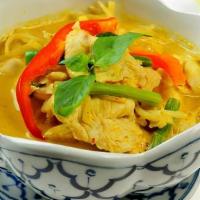 Yellow Curry · Yellow chili curry with coconut milk, pineapple, potatoes, onions, and bell peppers.