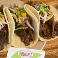 Short Rib Tacos · Short rib tacos simply melt in your mouth. Served with a refreshing jicama Manzano pepper sl...