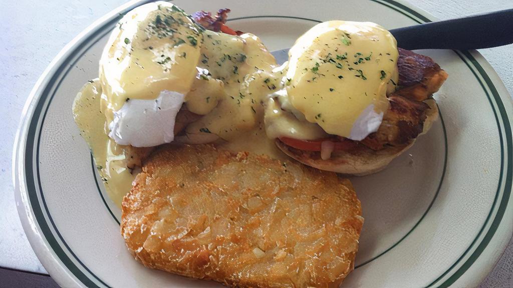 Southern Eggs Benedict · Two eggs on an English muffin with bacon and hollandaise. No toast.