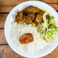Lunch Curry Goat · Served with white rice or rice & peas, steamed vegetable & sweet plantain.