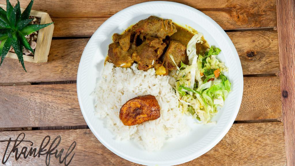 Lunch Curry Goat · Served with white rice or rice & peas, steamed vegetable & sweet plantain.