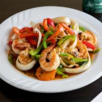 Lemongrass Shrimp · Tom Xa Ot - Sautéed with bell peppers, onions, and lemongrass sauce (spicy). Served with ste...