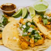 Tacos · Three soft corn tortilla tacos served with one choice of meat or vegetables, cilantro and on...