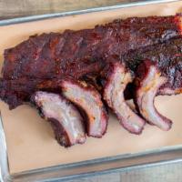 Baby Back Rib Platters · Slow smoked Baby Back Ribs rubbed with our Dry Rubb and Served with 2 sides.