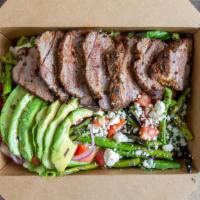 Butcher Salad · Pepper and thyme crusted steak, tomatoes, avocado, green beans, red onion, blue cheese, and ...