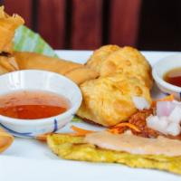 Erawan Samplers · Combination of golden spring rolls, golden bag, fried pork dumplings, fish cakes, shrimp rol...