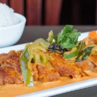 Crispy Duckling · Boneless half-duck with your choice of spicy basil leaves puree or spicy red curry cream sau...