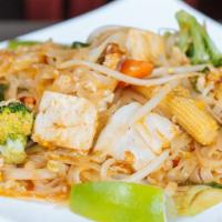 Ultimate Pad Thai · Stir fried thin rice noodles with egg, tofu, bean sprouts in tamarind sauce topped with crus...