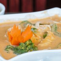 Yellow Curry · A savory curry with Turmeric, herbs, coconut milk, onions, bell peppers and potatoes. Served...