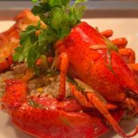 Stir Fried Lobster · Full Sautéed Lobster with Ginger and Scallion Sauce, Served over Garlic Noodles. Sweet and S...