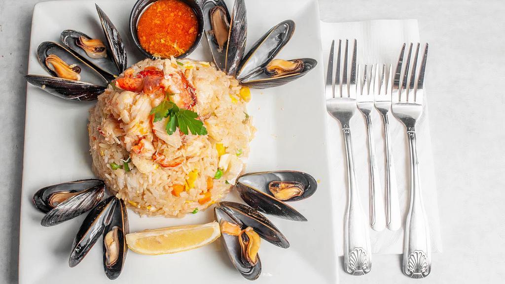 Seafood Fried Rice · A fan favorite!!! A mix of Lobster, Shrimp, King, Dungeness, and Snow crab meat (freshly cut) mixed with veggies, eggs and surrounded by mussels!