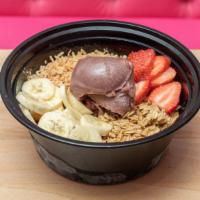 Acai Bowl · Acai sorbet topped with fresh strawberries, bananas, toasted coconut, and granola.