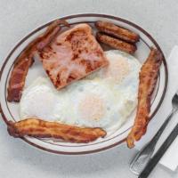 The Works · 3 Pancakes, 3 Eggs, Sausage, Bacon, & Ham, Served With Butter & Syrup
