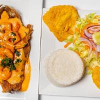 Trucha Marinera · Trout with shrimp in a pink sauce served with rice, plantains and salad.