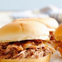 Pulled Pork Sandwiches · Delightful shredded pork slow cooked in a special sauce. served with choice of side.