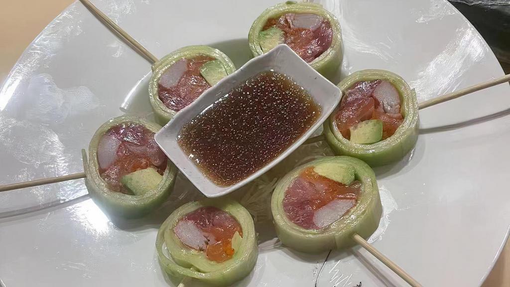 Naruto · Choice of tuna, salmon, yellowtail or crab stick rolled with avocado, thinly sliced cucumber and flying fish roe. Spicy version is available.