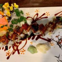 Godzilla Maki · King crab, avocado, tempura crunchy, topped with eel and multi color flying fish roe.