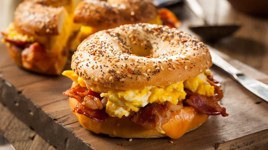 Eggs With Cheddar Cheese · Eggs with cheddar cheese on bagel or bread with Bacon, Sausage, or Ham