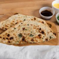 Chili Naan · Hot and spicy - not recommended for kids. Lightly buttered naan bread stuffed with green chi...
