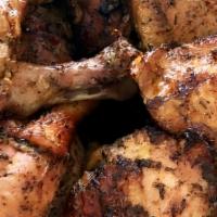 Grilled Jerk Chicken Platter · Grilled and very flavorful authentic jerk chicken served with rice  and 1 side.