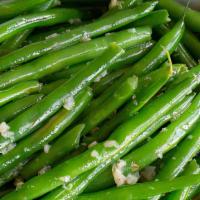 String Beans · Sautéed string beans with garlic, onions, and carrots.