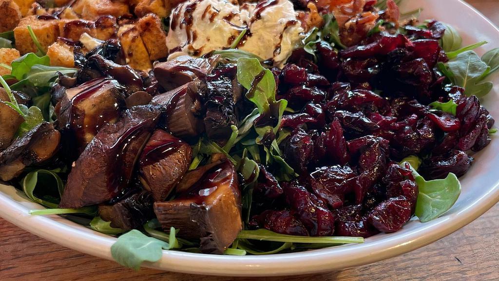 Porty Pig · Your choice of greens, bacon, roasted portobello, goat cheese, croutons, dried cranberry with balsamic glaze drizzle and balsamic vinaigrette