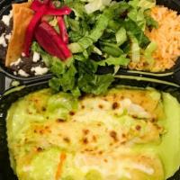 Enchiladas Suizas · Three chicken enchiladas with tomatillo sauce and cheese dip on top. Served with rice and be...