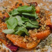 Un-Beet-Able Beet & Goat Cheese Salad · Whipped herb goat cheese, orange supremes and pistachio crumble.