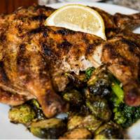 Cornish Hen · Wood grilled Cornish hen “under a brick” with chickpea fries, imbrecciata, cannellini beans,...