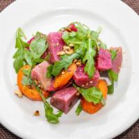 Beet Salad · Roasted beets and carrots with whipped goat cheese, hazelnuts and basil