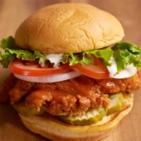 Firebird Sandwich · Crispy fried chicken, lettuce, tomato, pickles, onions, Buffalo sauce, house blue cheese, an...