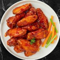Buckle Up Buffalo Wings · Fresh chicken wings breaded, fried until golden brown, and tossed in buffalo sauce. Served w...