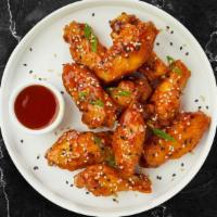 Honey Tang Wings  · Fresh chicken wings breaded, fried until golden brown, and tossed in sweet and sour sauce.