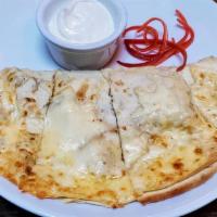 Steak & Peppers Quesadilla · Toasted flour tortilla stuffed with Monterey, Oaxaca & Chihuahua cheeses. Served with salsa ...