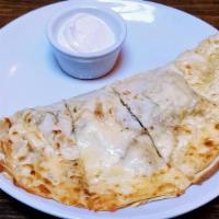 Wild Mushroom Quesadilla · Toasted flour tortilla stuffed with Monterey, Oaxaca & Chihuahua cheeses. Served with salsa ...