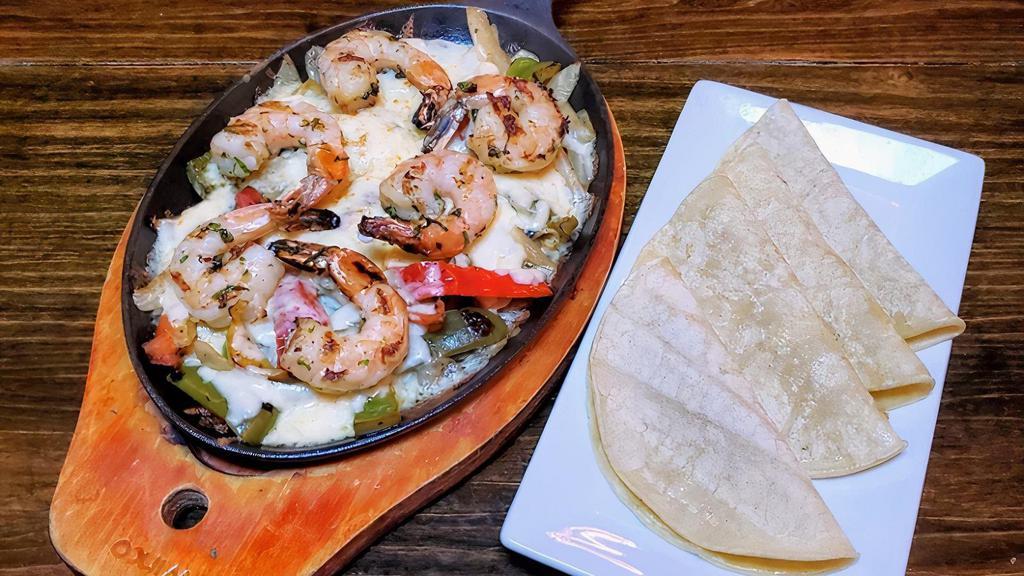 Shrimp Fajitas · Grilled onion, red & green peppers, Oaxaca cheese & corn tortillas. Served with white rice.