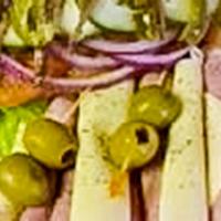 Romano’S Antipasto · Imported ham, capicola, genoa salami and anchovies on top of romaine lettuce with tomato, re...