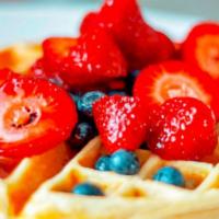 Buda'S Belgiam Waffle  · Homemade waffle ser ed with syrup whipped cream and assorted fruit topping .