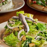 Romaine Lettuce, Spanish White Anchovies, Parmesan Cheese, & Red Onion · With Croutons and Homemade  Lemon Caesar Dressing