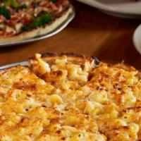 Mac 'N' Cheese · Elbow macaroni, caramelized onion, cream sauce, four cheeses, and toasted bread crumbs.