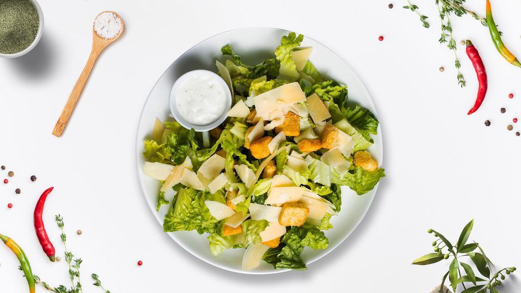 Caesar Out Of The Dark · (Vegetarian) Romaine lettuce, house croutons, and parmesan cheese tossed with Caesar dressing.