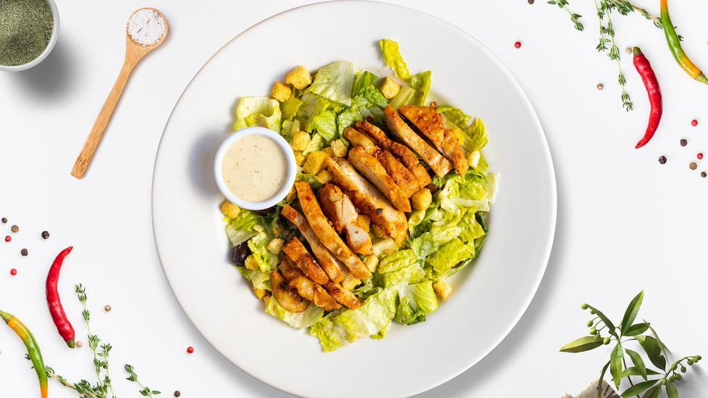 Cowardly Caesar Salad · Romaine lettuce, grilled chicken, house croutons, and parmesan cheese tossed with caesar dressing.