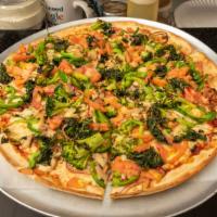 The Veggie Pizza · Onion, green peppers, broccoli, mushrooms, spinach, tomatoes and garlic. Vegetarian.