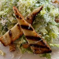 Caesar · Romaine hearts, garlic croutons, grilled focaccia classic dressing.