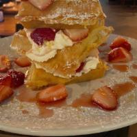 Strawberry Waffle Tower · macerated strawberries, mascarpone whipped cream, fresh belgian waffle.