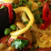 Paella Castellana · Spanish rice seafood combination with chicken and sausage.