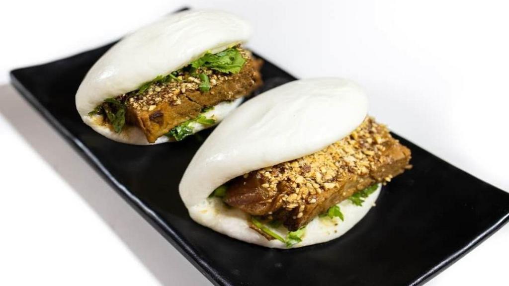 Pork House Bao (2 Pieces) · Pork belly, crushed peanuts, scallions, and cilantro.