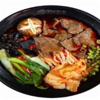 Hot & Spicy Magic Beef · Sliced beef, black fungus, mushroom, shanghai bok choy, scallions, kimchi in spicy beef broth.